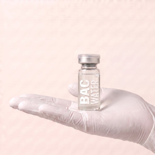 AURELIA bacteriostatic water 3ml vial held in a gloved hand, showing the vial size, for laboratory research use only
