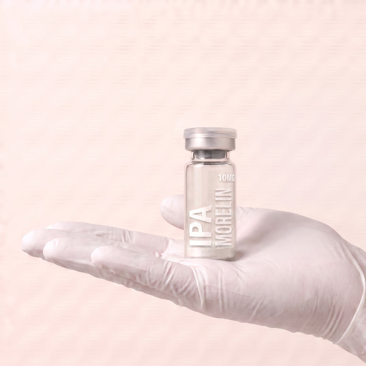 AURELIA Ipamorelin 10mg research peptide vial held in a gloved hand, showing the 3ml vial size, research use only