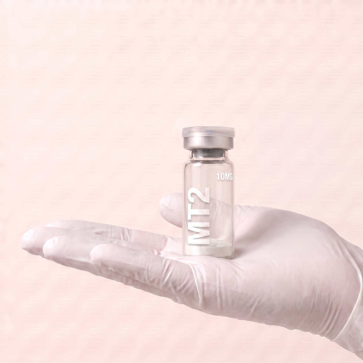 AURELIA MT-2 Melanotan II 10mg research peptide vial held in a gloved hand, showing the 3ml vial size, research use only